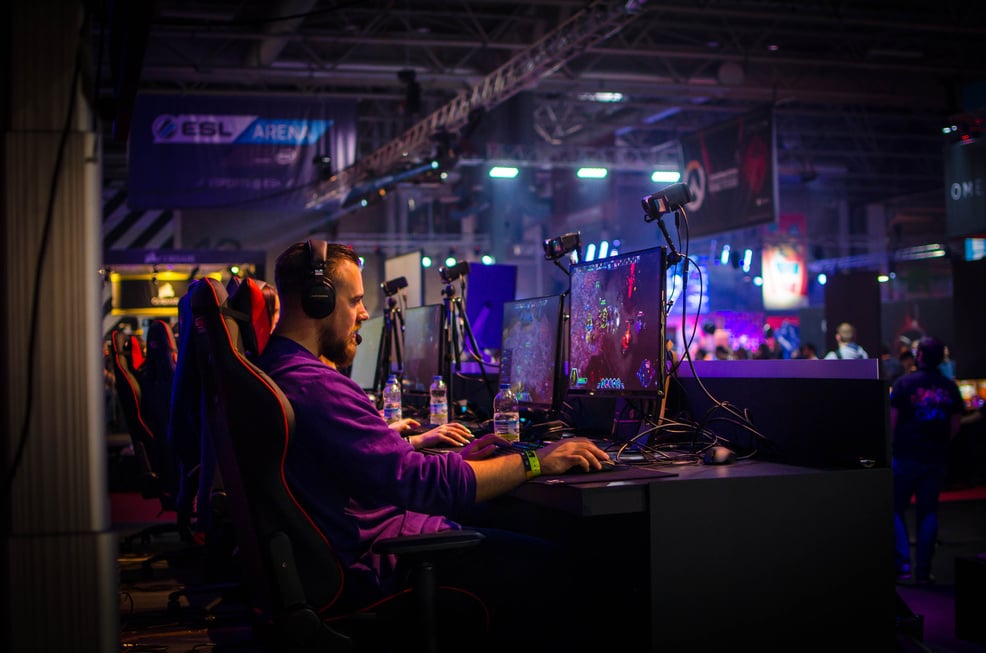 Man Playing Game on Personal Computer